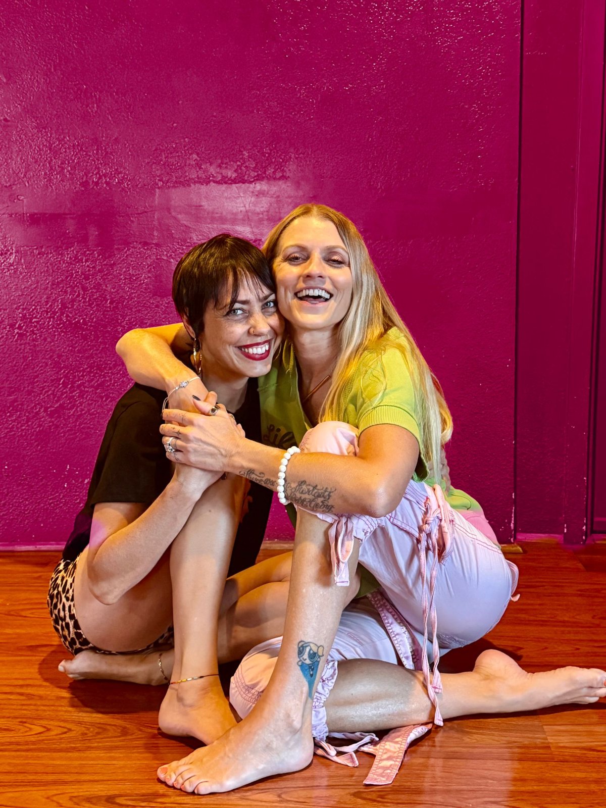 Melissa and Fawnia sitting together, smiling